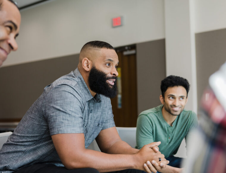 Diverse smile during support group meeting
