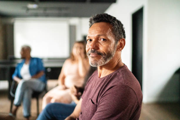 Portrait of a mature man at group session