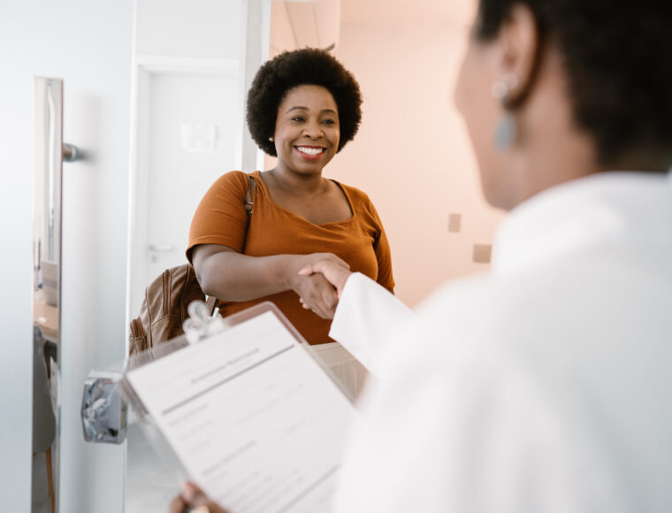 Woman meeting a staff member in a hospital setting