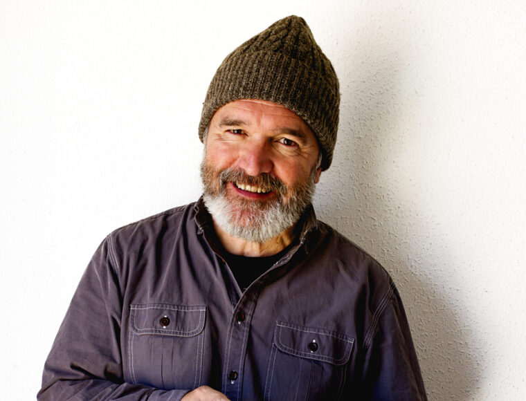 Portrait of smiling man with hat and beard