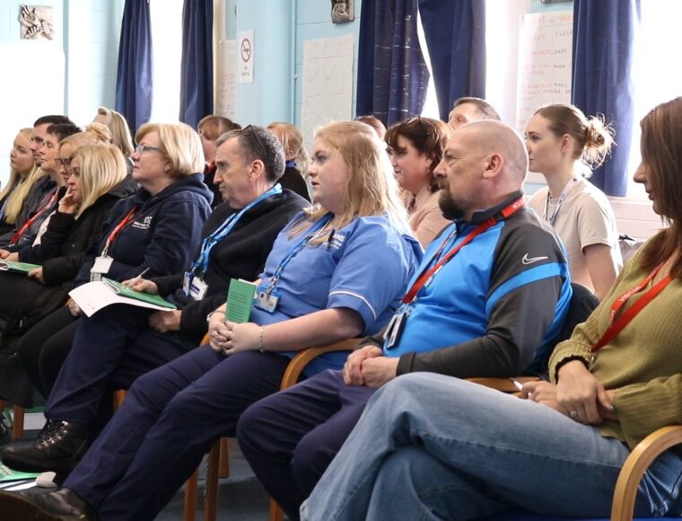 Group photo of SIG statff and guests at Father Inside Showcase in HMP Altcourse Liverpool
