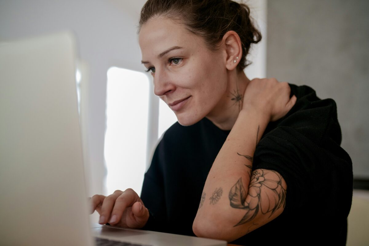 Woman browsing on a laptop