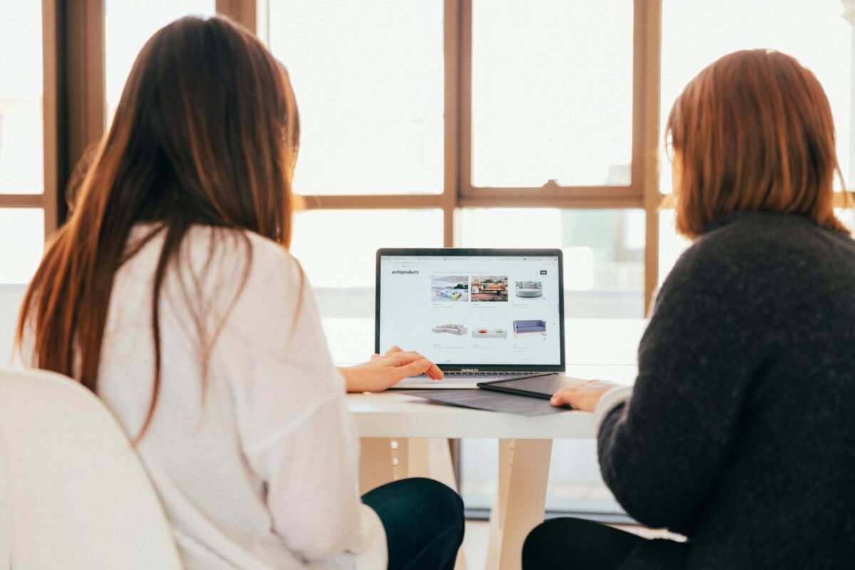 two women browsing looking at a website